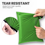 Hands stretching a green tear-resistant mailing bag made from strong polymer to show its durable design