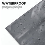 Close-up of a grey mailing bag with water droplets showing its moisture-resistant design.